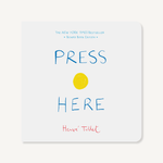 Press Here board book with colorful dots on cover—Available at Be Charmed