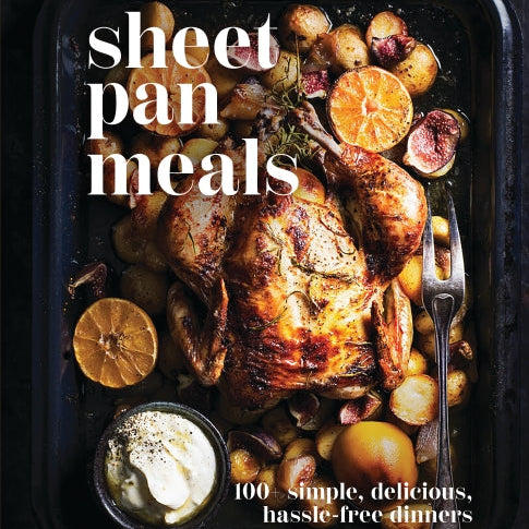 Sheet pan meal with roasted chicken and vegetables on a dark surface, featuring the text 'sheet pan meals' and '100 simple, delicious, hassle-free dinners'. Available at Be Charmed