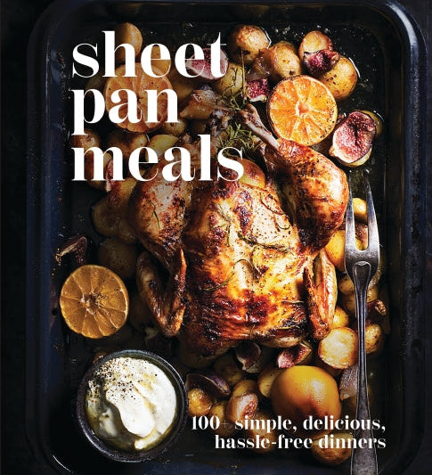 Sheet pan meal with roasted chicken and vegetables on a dark surface, featuring the text 'sheet pan meals' and '100 simple, delicious, hassle-free dinners'. Available at Be Charmed