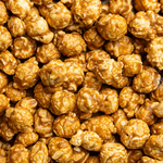 Close Up Picture of Poppy Handcrafted Popcorn Salted Caramel Snack Bag featuring buttery caramel popcorn with a touch of sea salt in a portable gourmet treat, available at Be Charmed