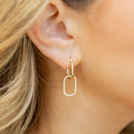 Close up of Gold Luxe Link Hoop Earrings by Chloe + Lois – modern gold-plated hoop earrings with interlocking chain-link design, bold yet lightweight statement piece, available at Be Charmed.