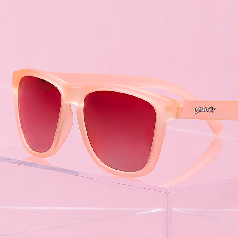 Goodr Don’t Make Me Blush polarized pink sunglasses with no-slip fit — Available at Be Charmed