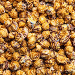Close up of Poppy Handcrafted Popcorn Birthday Confetti colorful gourmet popcorn with festive sprinkles. Available at Be Charmed