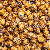 Close up of Poppy Handcrafted Popcorn Birthday Confetti colorful gourmet popcorn with festive sprinkles. Available at Be Charmed