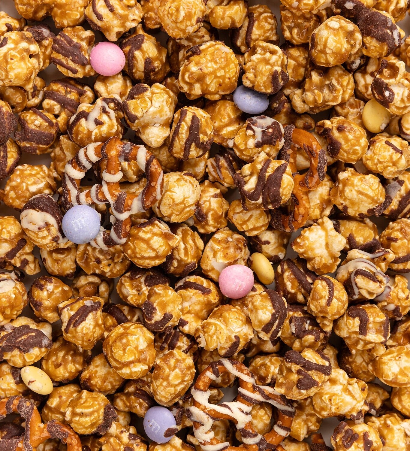 Close Up of Poppy Handcrafted Spring Confetti popcorn with colorful sweet coating and gourmet crunch, festive snack perfect for gifting, Available at Be Charmed