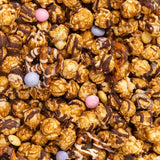 Close Up of Poppy Handcrafted Spring Confetti popcorn with colorful sweet coating and gourmet crunch, festive snack perfect for gifting, Available at Be Charmed