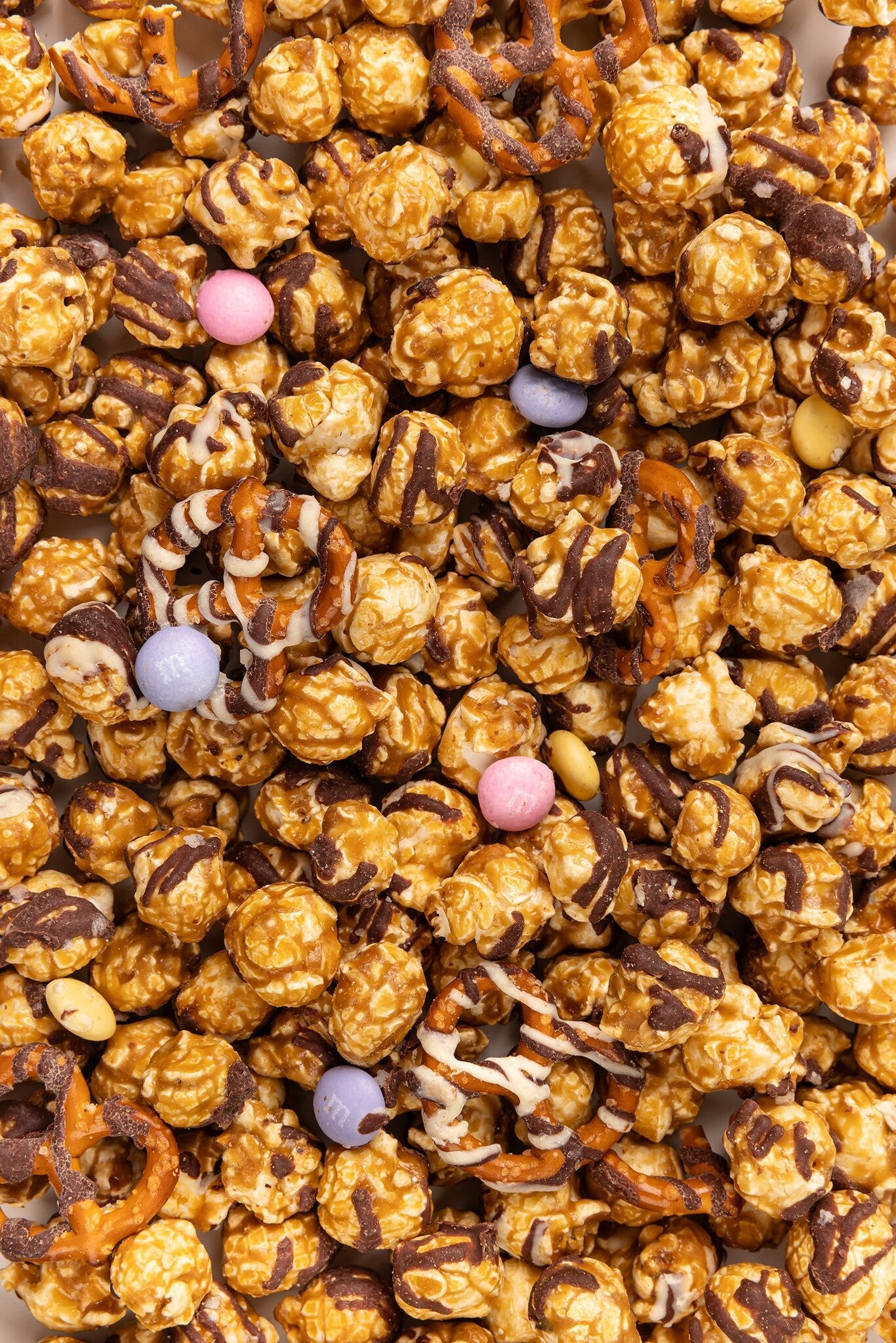 Close Up of Poppy Handcrafted Spring Confetti popcorn with colorful sweet coating and gourmet crunch, festive snack perfect for gifting, Available at Be Charmed
