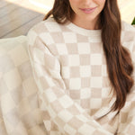 Close up picture of CozyChic Cotton Checkered in Oatmeal/Cream by Barefoot Dreams, soft breathable cotton blanket, available at Be Charmed
