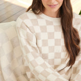 Close up picture of CozyChic Cotton Checkered in Oatmeal/Cream by Barefoot Dreams, soft breathable cotton blanket, available at Be Charmed