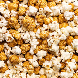 Close up picture of Poppy Handcrafted Popcorn Asheville Mix with a savory cheddar and sweet caramel blend in a small-batch gourmet snack, available at Be Charmed