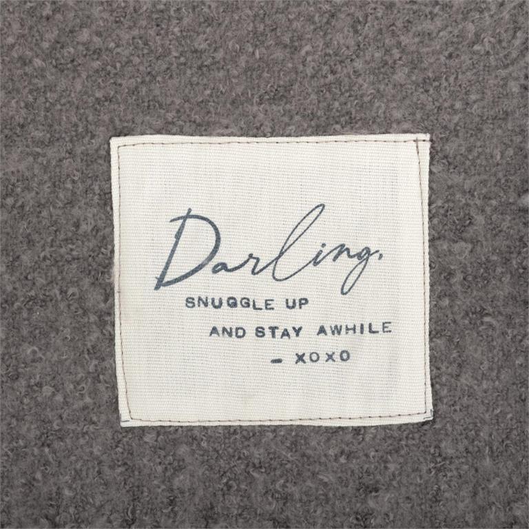 Close up picture of the tag on Demdaco Dear You Blanket – Darling, 50"x60" soft polyester throw with fringe and heartfelt message. Available at Be Charmed