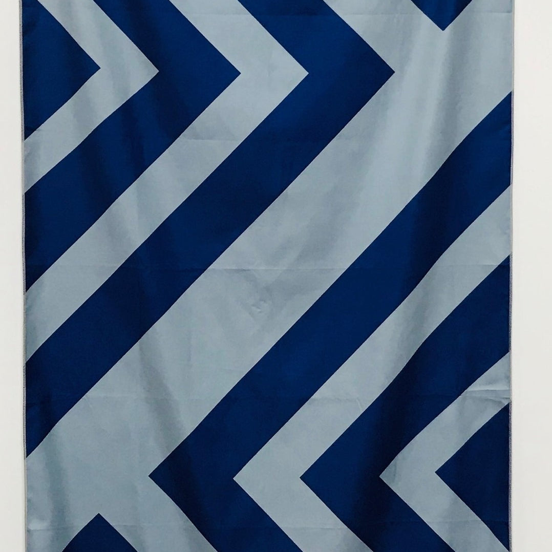 32″×64″ Clutch Towels oversized towel with bold navy and gray zig-zag pattern, soft and absorbent. Available at Be Charmed