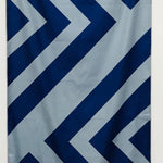 32″×64″ Clutch Towels oversized towel with bold navy and gray zig-zag pattern, soft and absorbent. Available at Be Charmed