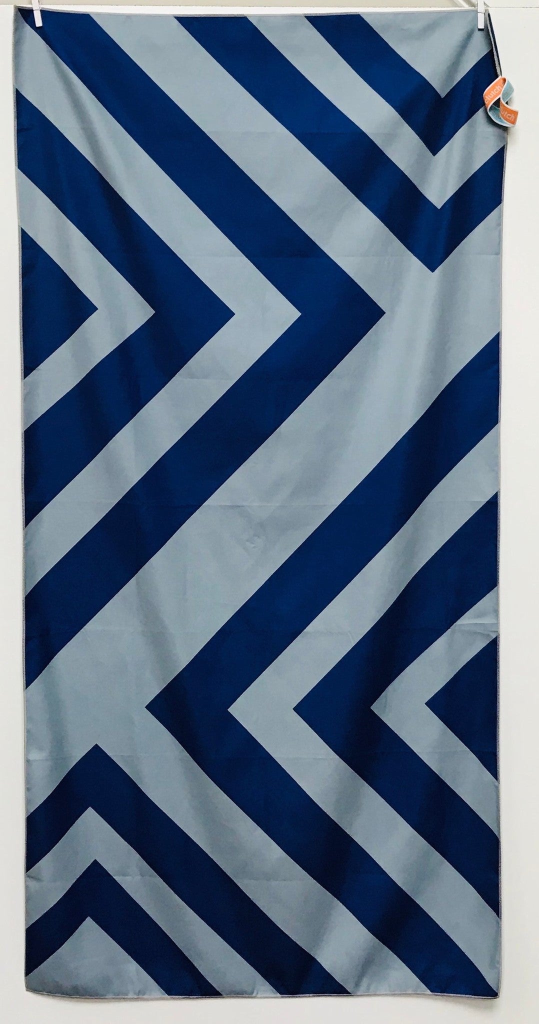 32″×64″ Clutch Towels oversized towel with bold navy and gray zig-zag pattern, soft and absorbent. Available at Be Charmed