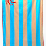 32″×64″ Clutch Towels “Feeling Crabby” oversized towel with bright red crab print, perfect for beach days or poolside. Available at Be Charmed