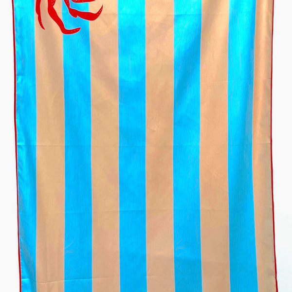 32″×64″ Clutch Towels “Feeling Crabby” oversized towel with bright red crab print, perfect for beach days or poolside. Available at Be Charmed
