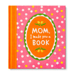 Book titled 'Mom, I made you a Book' with pink polka dot cover. Available at Be Charmed