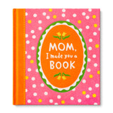 Book titled 'Mom, I made you a Book' with pink polka dot cover. Available at Be Charmed
