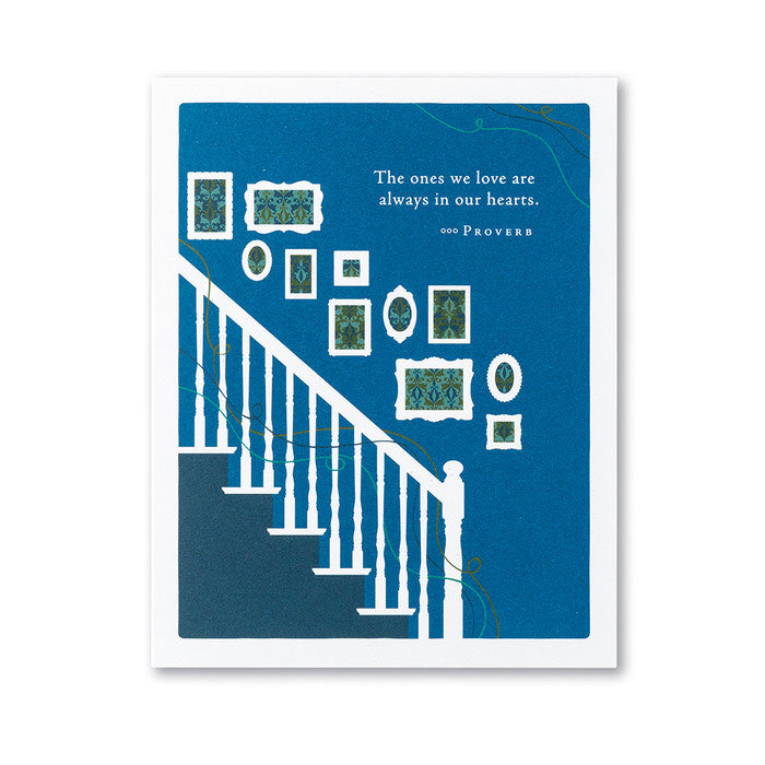 A sympathy card with a blue background featuring white text and illustrations that include decorative patterns and a staircase. Available at Be Charmed