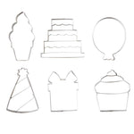 Cookie Cutters for Creative Brands Birthday cookie cutter set in a magnetic book-style box with 6 stainless steel shapes (cake, balloon, candle, present, party hat, heart) and a lemon sugar cookie recipe inside lid—Available at Be Charmed