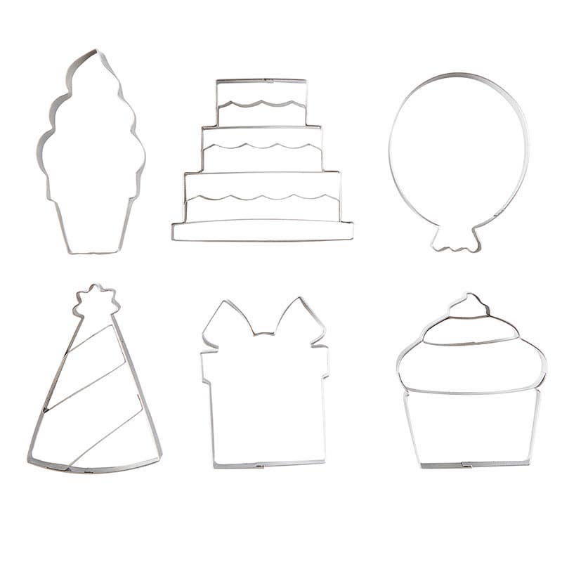 Cookie Cutters for Creative Brands Birthday cookie cutter set in a magnetic book-style box with 6 stainless steel shapes (cake, balloon, candle, present, party hat, heart) and a lemon sugar cookie recipe inside lid—Available at Be Charmed