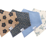 Three-bandana bib set in Gemma Tan print by Copper Pearl—soft cotton, snap closures, double-layer absorbency—Available at Be Charmed