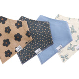 Three-bandana bib set in Gemma Tan print by Copper Pearl—soft cotton, snap closures, double-layer absorbency—Available at Be Charmed