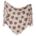 opper Pearl Knit Swaddle Blanket in Gemma Tan – ultra-soft, stretchy swaddle for newborns in a stylish tan floral print, perfect for cozy wraps, nursing, and stroller use. A must-have baby essential, available at Be Charmed.