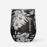 Corkcicle 12oz Stemless in Black Luau – tropical-inspired triple-insulated stainless steel tumbler featuring a vibrant floral design over a black background. Includes a clear, spill-resistant lid. Keeps drinks cold for 9+ hours or hot for 3+. Perfect for wine, cocktails, or coffee. Available at Be Charmed.