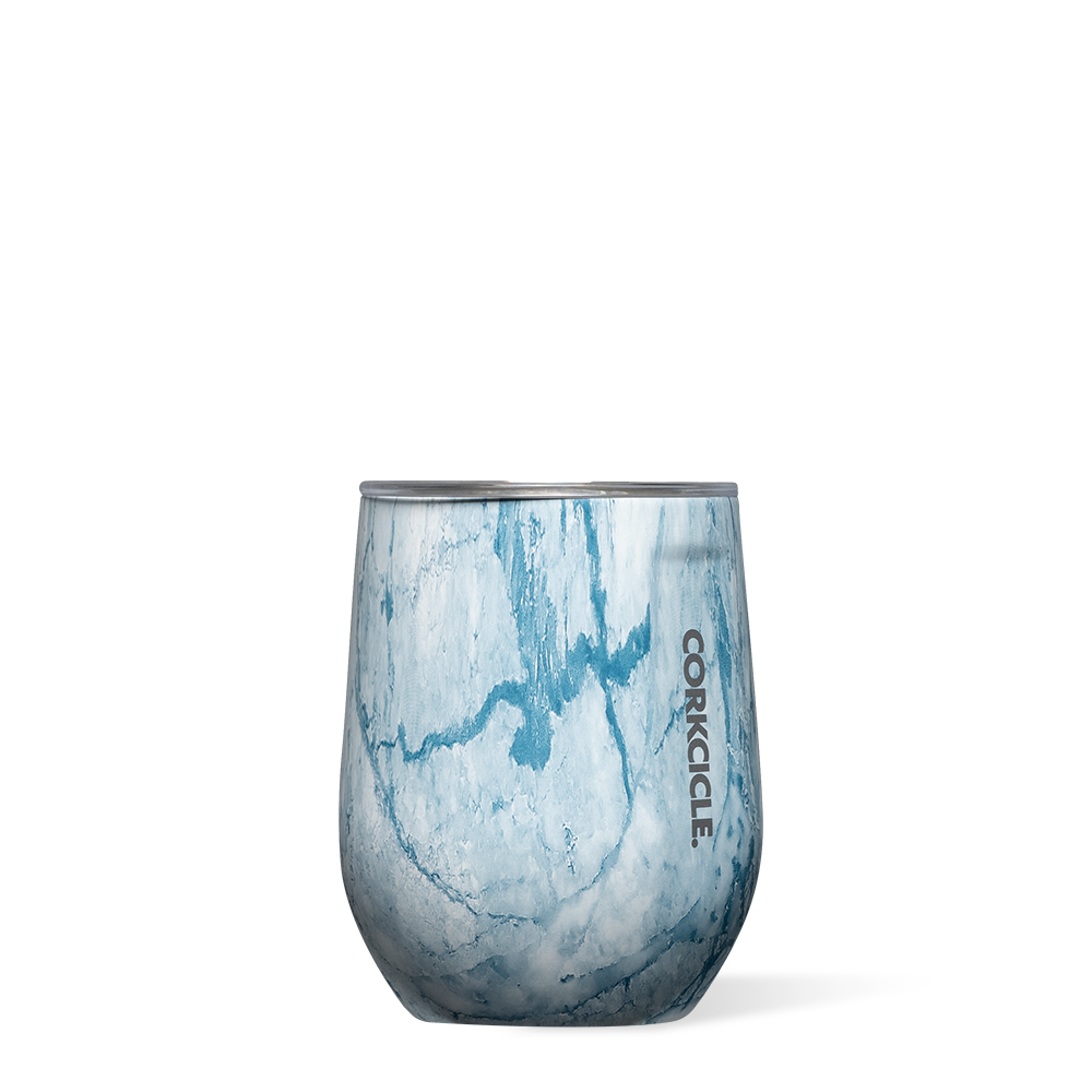 Corkcicle 12oz Stemless in Blue Marble – triple-insulated stainless steel tumbler with an elegant blue marbled design, glossy finish, and clear, spill-resistant lid. Keeps beverages cold for 9+ hours or hot for 3+. Ideal for wine, cocktails, or coffee. Available at Be Charmed.