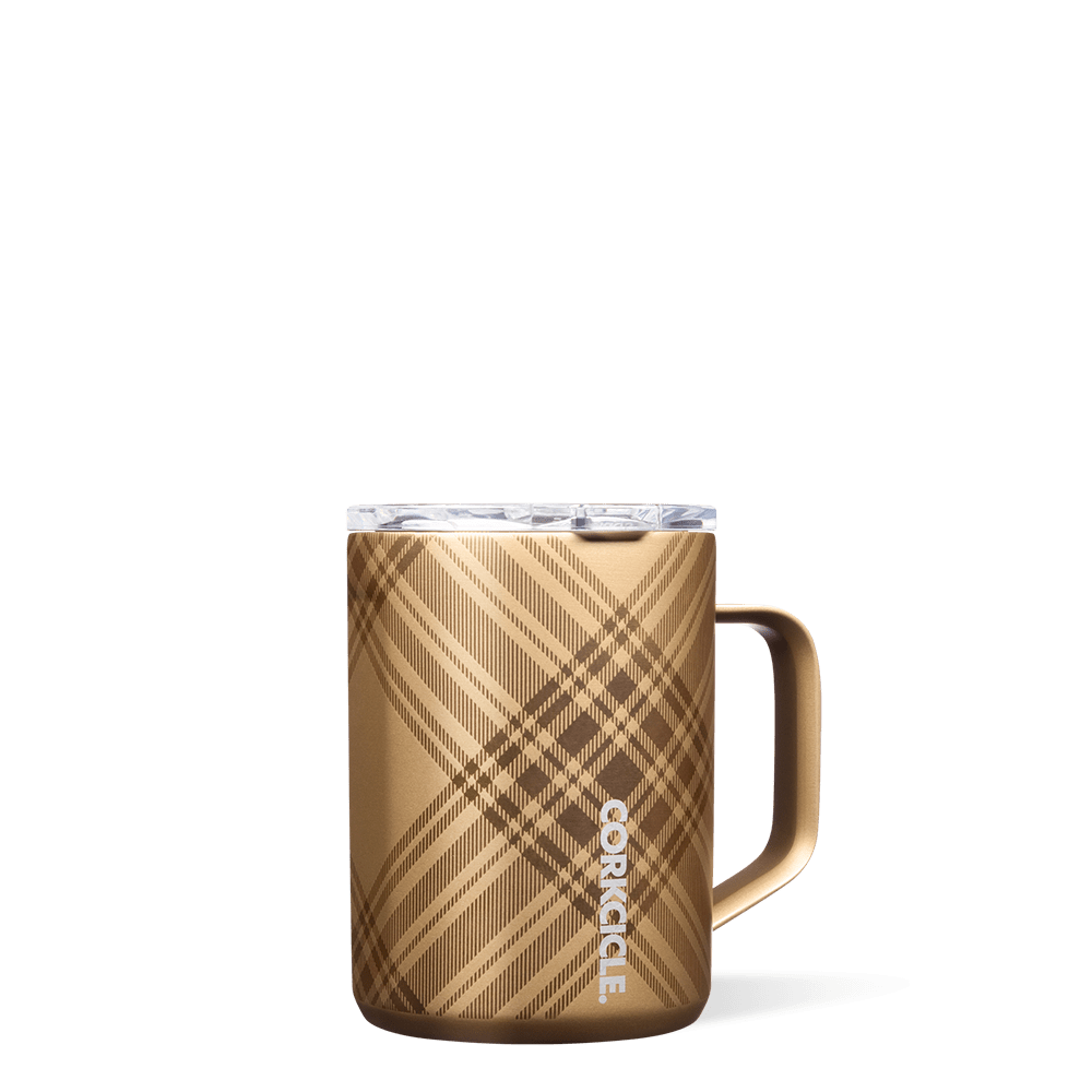 Corkcicle 16oz Mug in Golden Plaid – triple-insulated stainless steel mug with a festive gold and white plaid pattern, clear spill-resistant lid, and easy-grip handle. Keeps beverages hot for hours. Perfect for cozy holiday sipping, available at Be Charmed.
