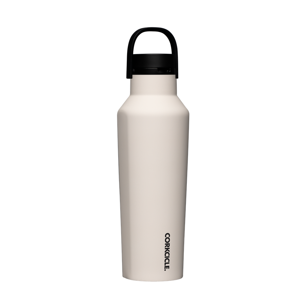 Corkcicle 20oz Sport Canteen in Latte – durable, insulated sport canteen with a soft latte beige finish. Features double-wall vacuum insulation to keep drinks cold for hours, a leak-resistant cap, and a convenient carry handle. Perfect for workouts, hikes, or daily hydration. Available at Be Charmed.