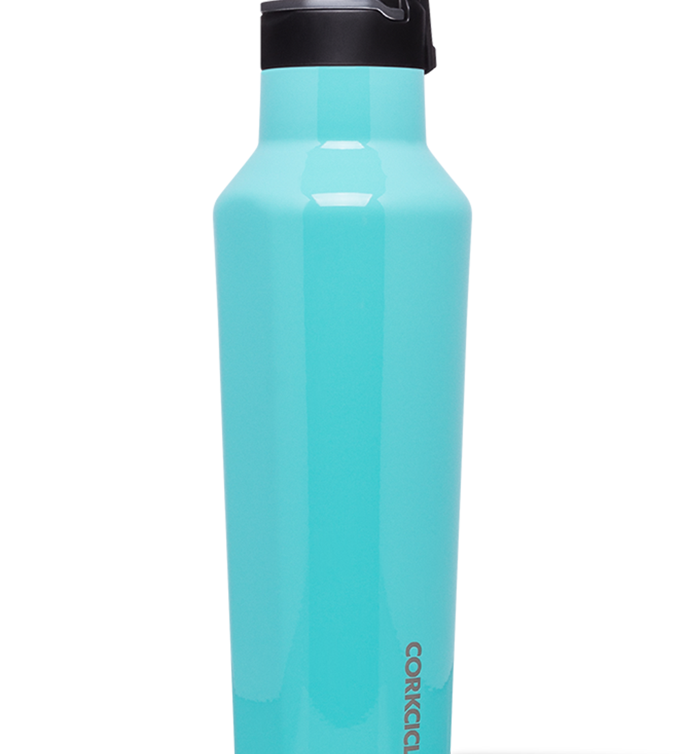 Corkcicle 20oz Sport Canteen in Turquoise – vibrant triple-insulated stainless steel water bottle in a refreshing turquoise finish. Features a built-in carry handle and quick-sip sport lid. Keeps drinks cold for 25+ hours or hot for 12. Lightweight, durable, and ideal for active lifestyles. Available at Be Charmed.