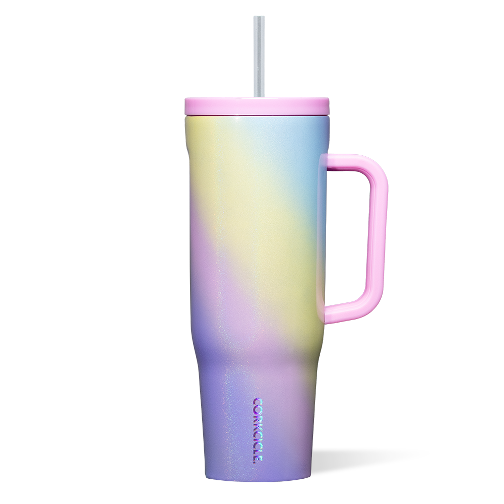 Corkcicle 40oz Cruiser in Rainbow Unicorn – bold, iridescent tumbler with triple insulation, soft-grip handle, and spill-resistant lid with straw. Magical hydration made stylish, available now at Be Charmed.