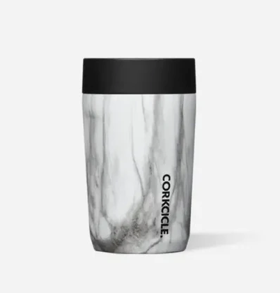 Marble-patterned tumbler with black lid on a white background. Available at Be Charmed