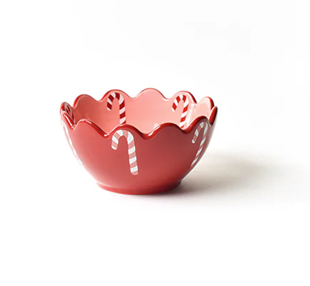 Red decorative bowl with candy cane design on a white background. Available at Be Charmed. 