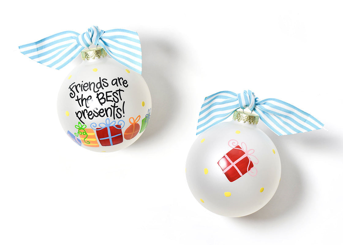 Two round glass ornaments with a text 'Friends Are The Best Presents!' and decorated with colorful presents, yellow polka dots, black writing, and blue and white accent ribbons. Available at Be Charmed