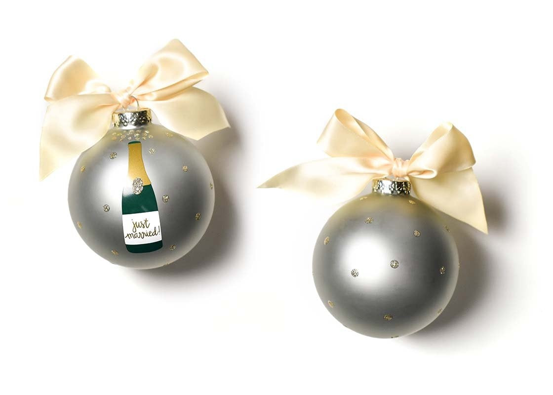 Coton Colors “Just Married” Champagne Pop glass ornament with hand-painted champagne bottle, gold glitter polka dots & cream ribbon; includes swirl stand & gift box – Available at Be Charmed
