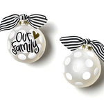 Two white Christmas ornaments with black text and ribbons on a white background. Available at Be Charmed