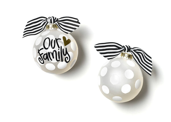 Two white Christmas ornaments with black text and ribbons on a white background. Available at Be Charmed