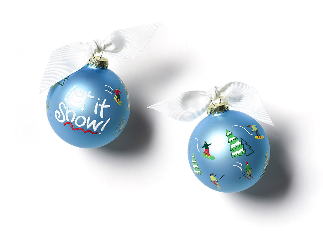 Two blue Christmas ornaments with festive designs on a white background. Available at Be Charmed
