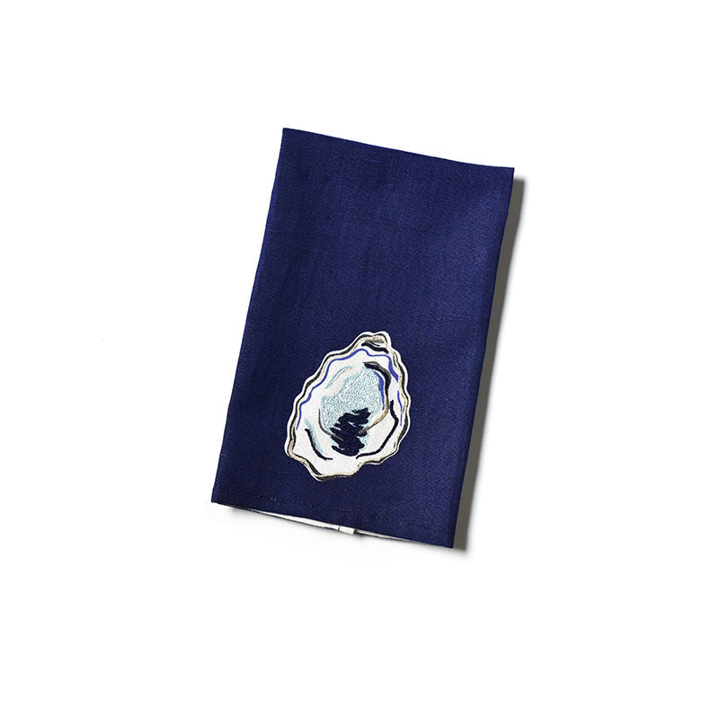 Navy blue dish towel with a white emblem on a white background. Available at BE Charmed