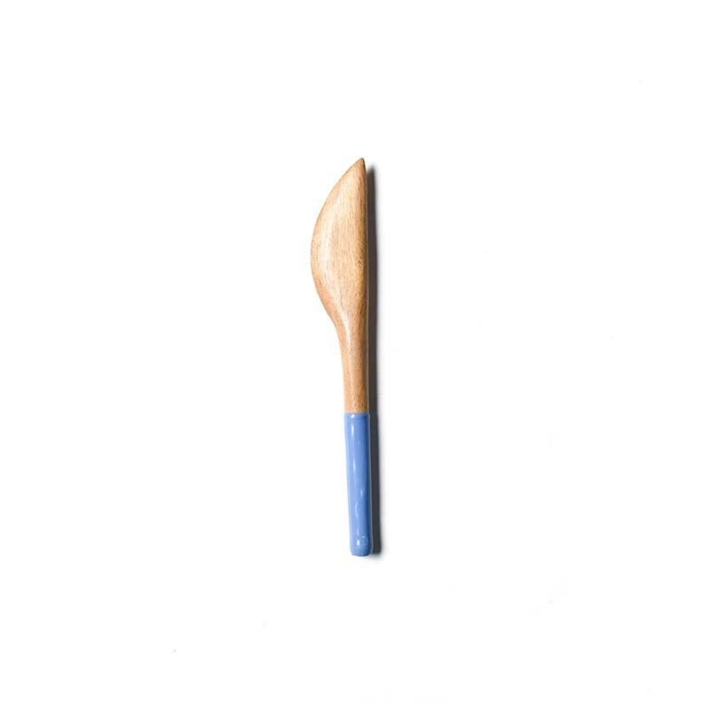 Wooden sspreader with a blue handle on a white background. Available at Be Charmed