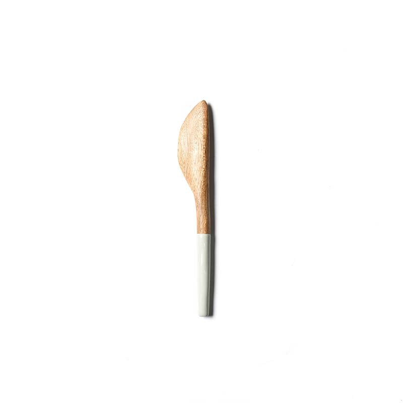 Spreader knife with wooden handle on a white background. Available at Be Charmed