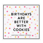 Creative Brands Birthday cookie cutter set in a magnetic book-style box with 6 stainless steel shapes (cake, balloon, candle, present, party hat, heart) and a lemon sugar cookie recipe inside lid—Available at Be Charmed