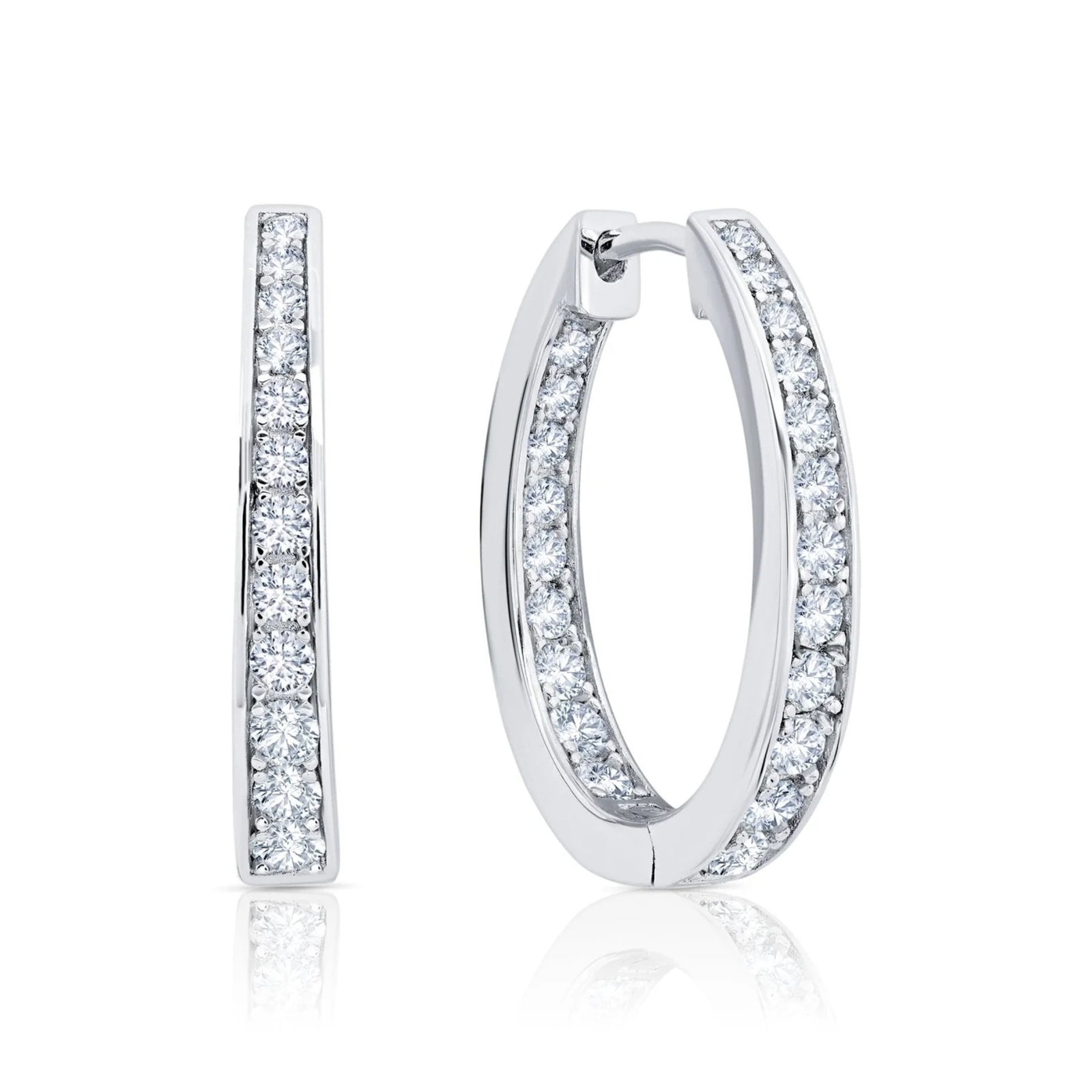 Pair of silver hoop earrings with CZ on a white background. Available at Be Charmed
