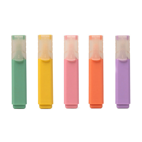 Five colorful highlighters in green, yellow, pink, orange, and purple on a white background. Available at Be Charmed