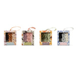 Four decorative boxes with different patterns and colors on a white background. Available at Be Charmed