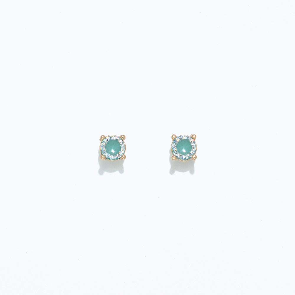 A pair of aqua and mint-colored cubic zirconia stud earrings on a white background. Available at Be Charmed