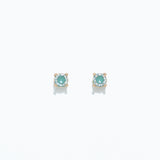 A pair of aqua and mint-colored cubic zirconia stud earrings on a white background. Available at Be Charmed